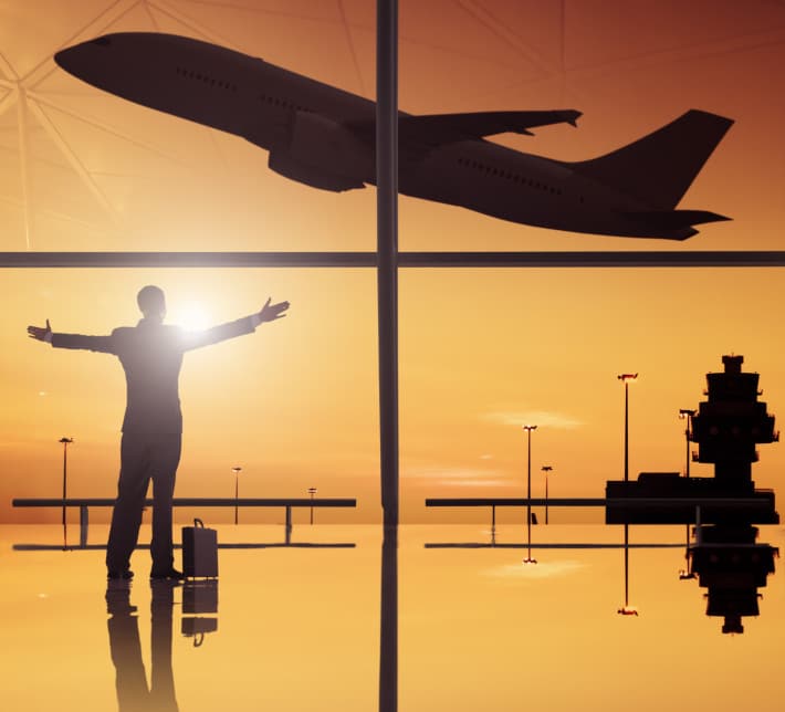 Silhouettes Of Business And Airplane In Airport